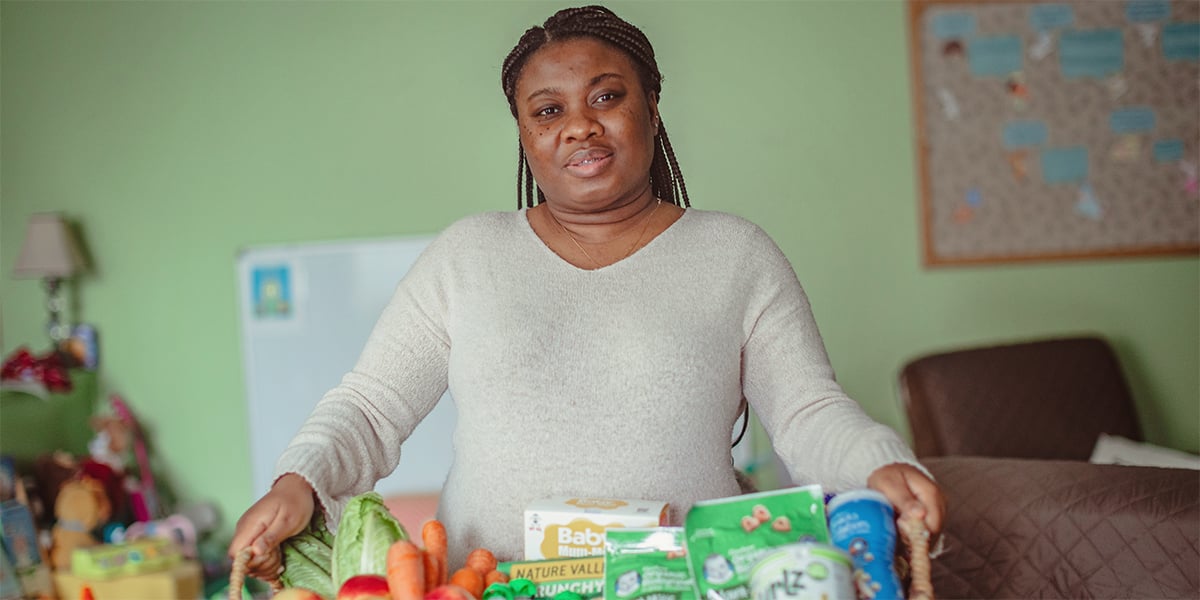 Woman holding a basket of food