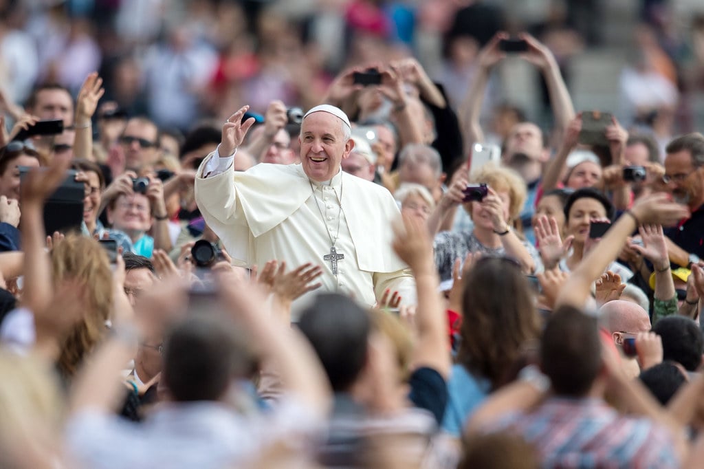 Pope Francis Surrounded by a Large Crowd