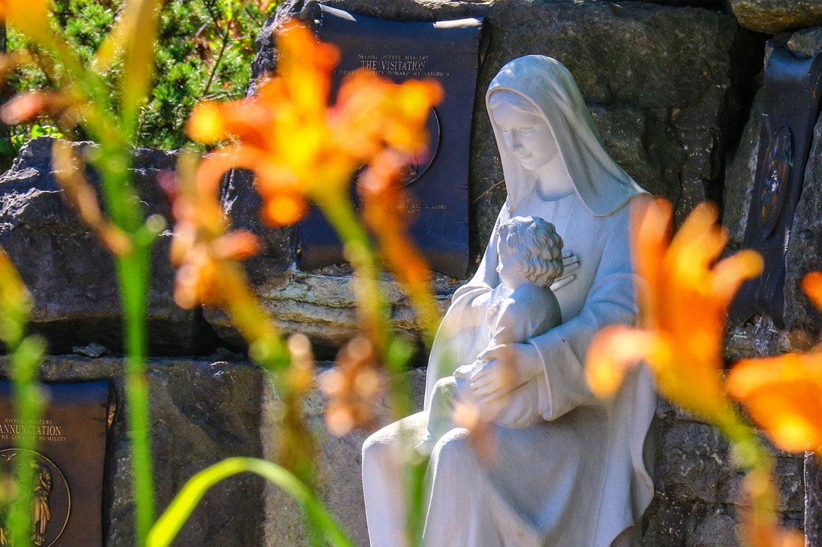 Catholic Cemeteries statue and flowers